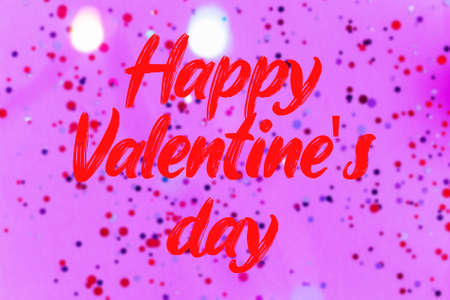 Happy Valentines Day text on bokeh and confetti background