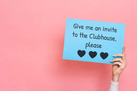VICHUGA, RUSSIA, February 18, 2021: A womans hand holds a sign that reads Give me an invite to the...