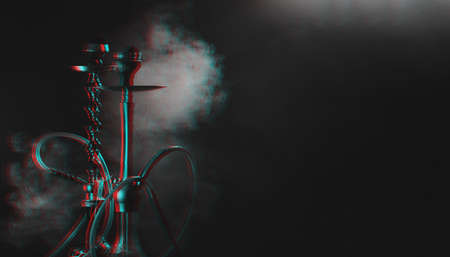 Hookah, shisha on a smoky black background with smoke. Glitch, black and white. Place for your textの写真素材