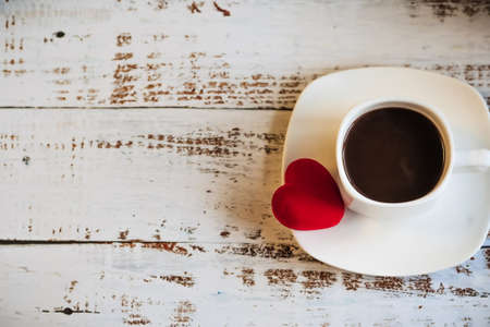 Red hearts and a Cup of coffee. the concept of Womens Valentines Day. Place for text, place for copying.の写真素材
