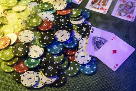 casino concept: playing cards, betting chips, money. Top view. Smoke added to the photoの写真素材