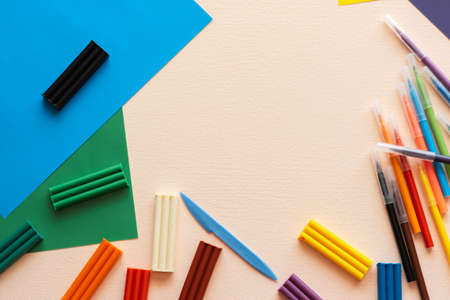 A set for childrens creativity and development. Plasticine, felt-tip pens, colored paper on the table. Place for your textの写真素材