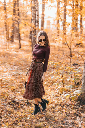 beautiful girl has a great time in the autumn Parkの写真素材