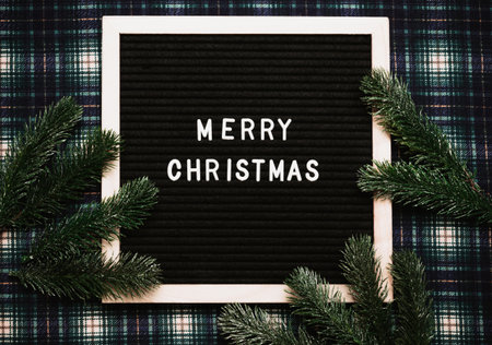 Merry Christmas message on an old vintage letter board. Top view. Flatley. Ready-made Christmas greeting card.の写真素材
