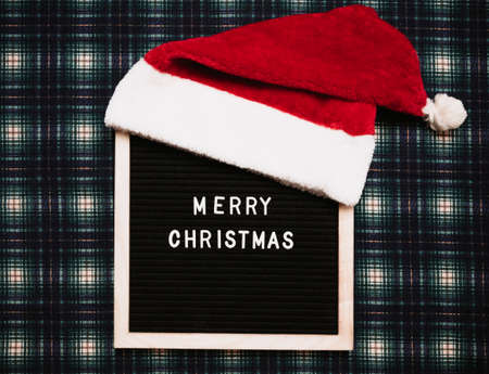 Merry Christmas lettering in plastic letters on an old vintage letter board. Top view. Flatley. Christmas greeting card.の写真素材