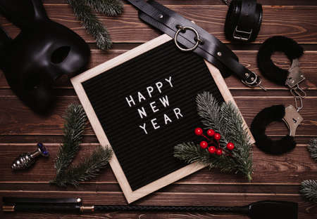 Happy New Year written in plastic letters on a letter board. A set of toys for adults. Top view. Flatley.の写真素材