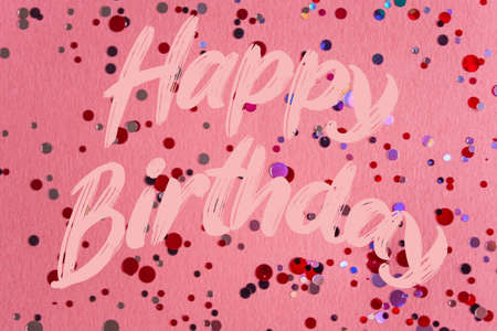 Happy Birthday text on pink confetti backgroundの写真素材
