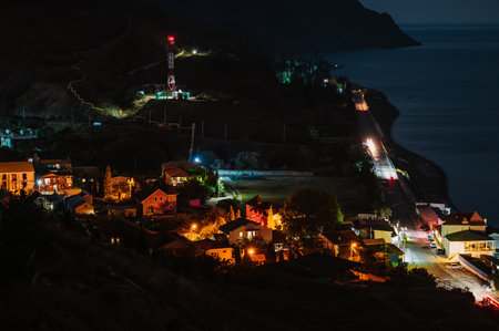 Night landscape. View of the night city near the sea coastの写真素材