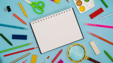 Back to school soon. buying stationery, flatlay, a place to copy your text or advertising on a white tablet. Bright background. photo 16:9の写真素材