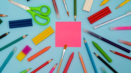 Back to school soon. buying stationery, flatley, a place to copy your text or advertising on a bright sticker. Bright background. photo 16:9の写真素材