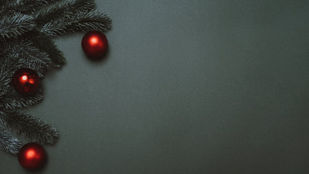 New Years flatley. Christmas tree, cones, balls, on a solid green background. Empty space for your ad or text.の写真素材