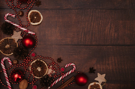 Christmas frame, in the style of flatley with Christmas decorations made of balls, cones, spices. The concept of celebrating the New Year. Top view. A place for your text.の写真素材