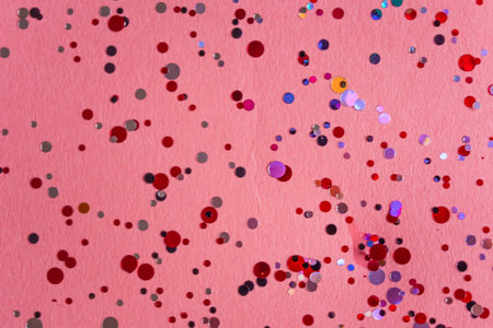 Pink background with confetti with space for text. valentines day, birthday.の写真素材
