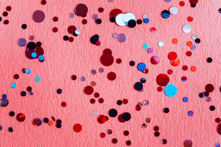 Pink background with confetti with space for text. valentines day, birthday.の写真素材