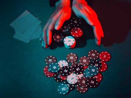 mens hands place a bet with playing chipsの写真素材