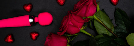 BDSM female adult toy set with roses. Set for Valentines Day. Horizontal wide photo subtitle, cover. copy-spaceの写真素材