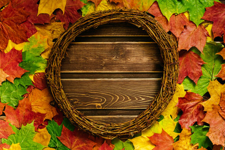 autumn background with colored leaves on a dark wooden background with space for textの写真素材