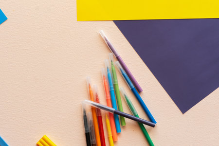 A set for childrens creativity and development. felt-tip pens, colored paper on the table.の写真素材