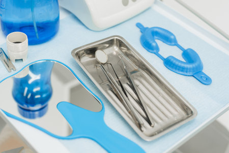A set of dental instruments on the table in the dentists office.の写真素材