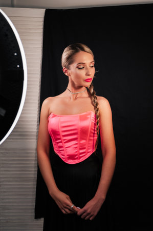 Shooting for social networks, an insider girl shoots an image made by a makeup artist and a hairdresser. Promotion in social networks. networks.の写真素材