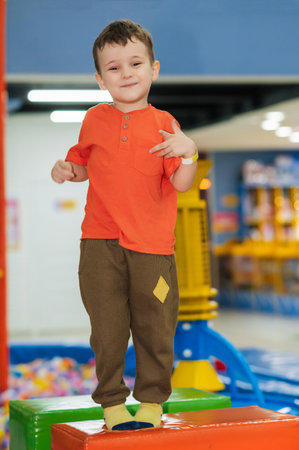 A boy plays in a childrens entertainment centerの写真素材