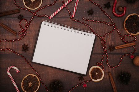 Christmas New Year paper frame, flatley style with a top view with Christmas decorations made of balls, cones, spices.の写真素材