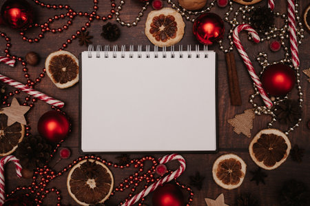 Christmas New Year paper frame, flatley style with a top view with Christmas decorations made of balls, cones, spices.の写真素材