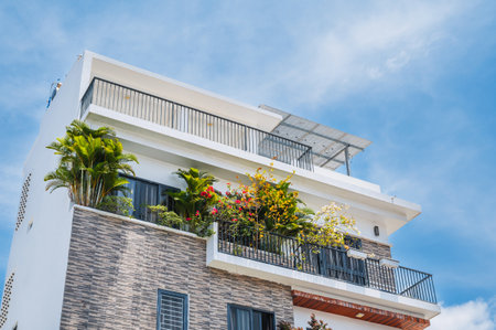 Sustainable glass office building with trees for reducing carbon dioxide.の写真素材