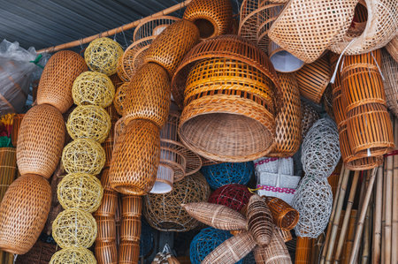 A set of handmade traditional Asian floor lamps made of rattan and natural fiber for sale at the outdoor market in Nha Trang, Vietnamの写真素材