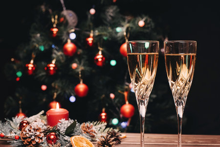 Champagne glasses on a sparkling new years backgroundの写真素材