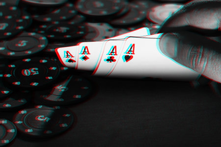 mens hands hold cards , a set of aces on the background of playing chips. Black and white with 3D...