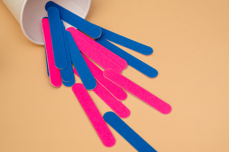 A set of manicure nail files with the same abrasive, highlighted on a light background.の写真素材