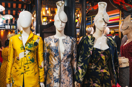 Womens evening dresses displayed on mannequins are standing on the street.の写真素材