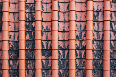 A close-up image of the traditional tile roof pattern of an old temple. Texture for the backgroundの写真素材