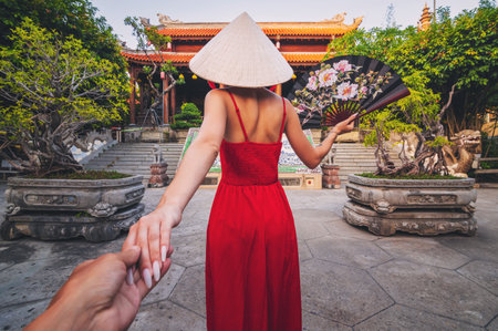 A female tourist in a traditional Vietnamese conical hatの写真素材