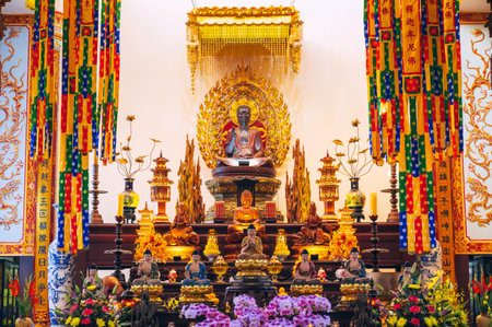 The interior and altar of a Buddhist temple in Asia, Vietnam, at the Long Son pagodaの写真素材