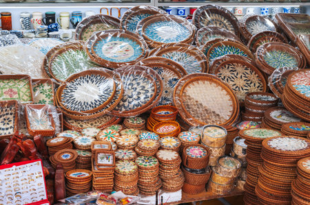 Bamboo wicker plates on display at a local Vietnamese market for sale.