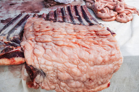 Meat on the counter at the market. An assortment of raw meat with fat.の写真素材