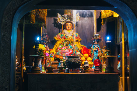 The altar inside the Huyen Khong Cave and the Buddha in the Marble Mountains in Da Nangの写真素材