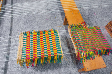 weaving and making a handmade rug. close-up of a loom.の写真素材