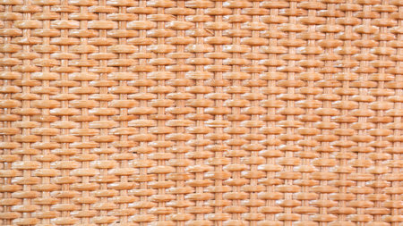 brown background with wavy rattan texture. The background of a wicker basket.の写真素材