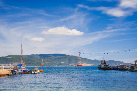 A landscape with Vietnamese boats in the sea and a view of the island.の写真素材