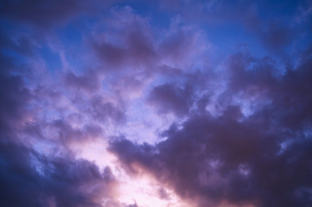Twilight, sunset sky, clouds in the evening at dusk with blue, purple, light.の写真素材