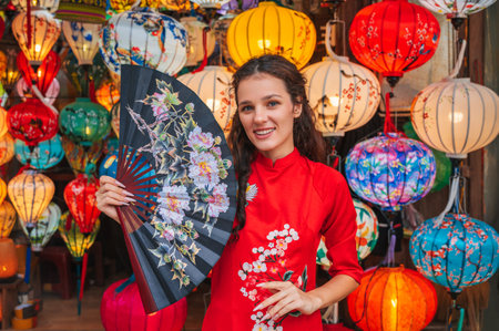 Asian woman wearing Vietnam culture traditional and hoi an lanterns at Hoi An ancient townの写真素材
