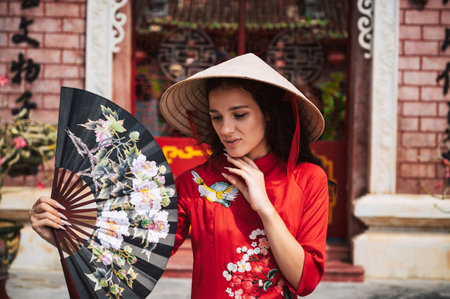 Woman Tourist at Fukian Assembly Hall in the Hoi An ancient town, Vietnamの写真素材