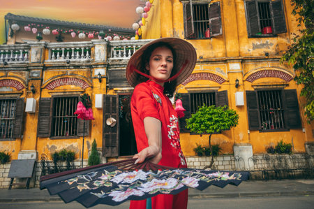 Portrait of a young woman in traditional costume of Vietnamese culture in Hoi An, Vietnamの写真素材