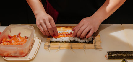 chefs hands, Japanese food preparation - sushi, chef, Maki roll preparationの写真素材