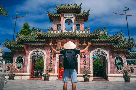 Tourist man walking at Fukian Assembly Hall in the Hoi An ancient town, Vietnam