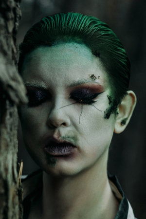close-up fantasy makeup portrait with moss and insectの写真素材