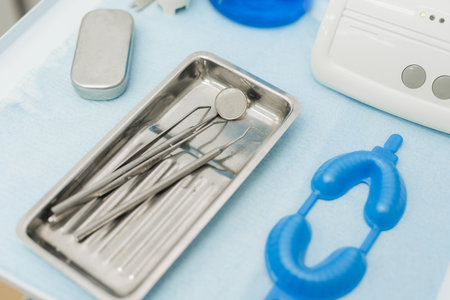 A set of dental instruments on the table in the dentists office.